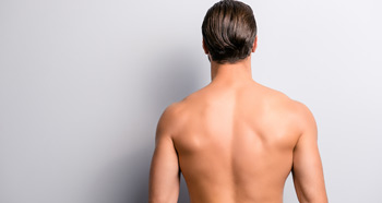 Man getting laser hair removal on his back