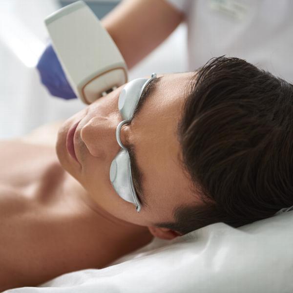 Man getting laser hair removal on his face